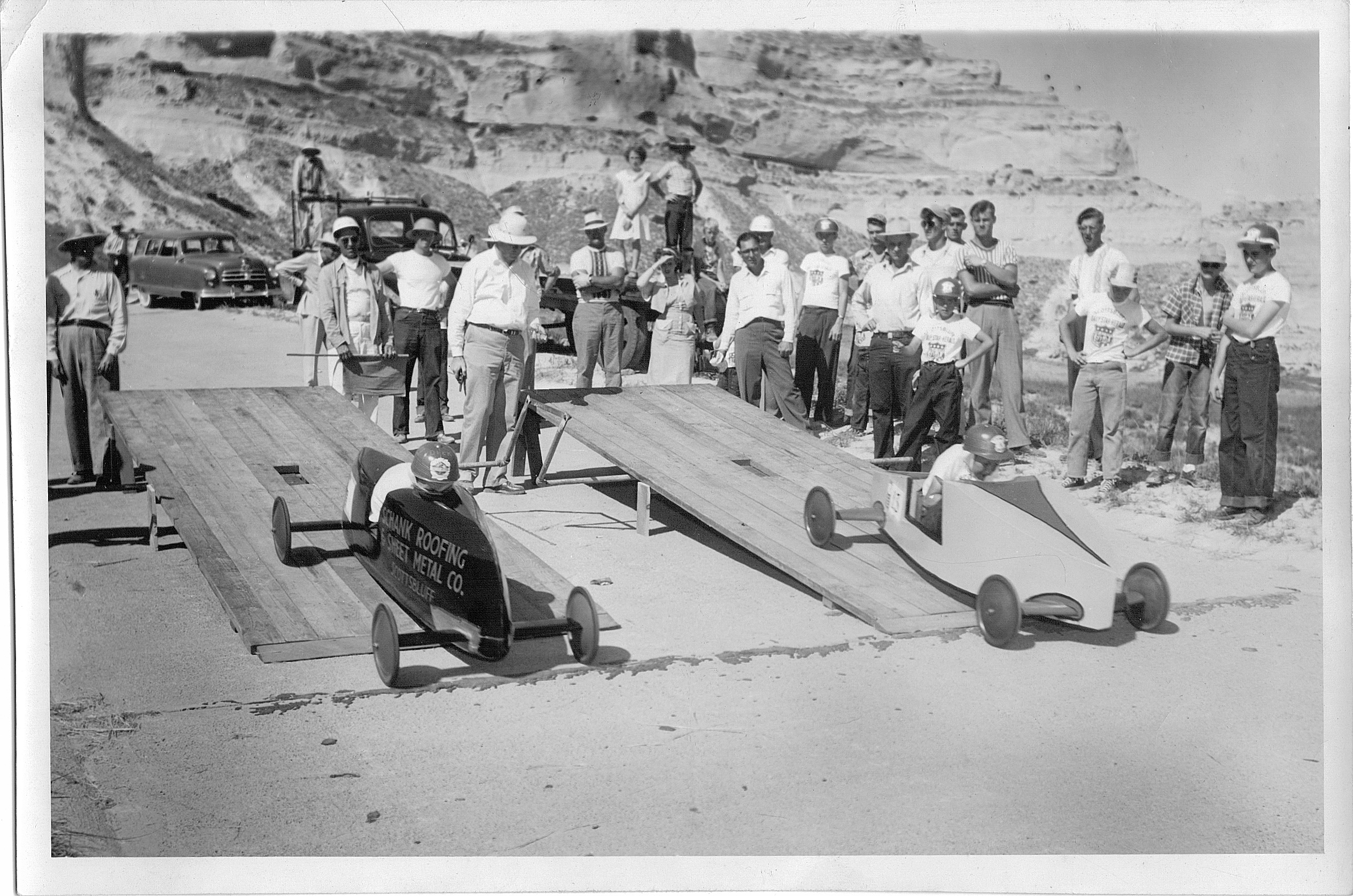 The final race on Derby Day: Dick Otte vs. Tommy Cone. (The man on the far left appears to be Dick's father Fred, and the woman standing at the very top- on the bed of the truck- looks like his mother Dolly. Standing next to her is likely her brother, the "Schank" in Schank Roofing that appears on the side of Dick's racer.)